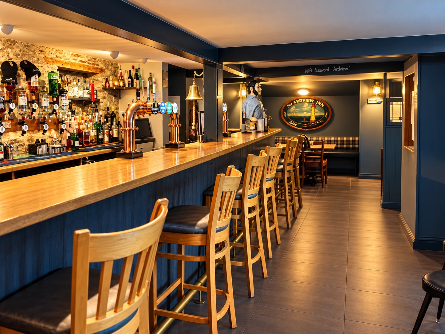 Timber bar counter and warm lighting inside Ardview Inn in Port Ellen, Islay