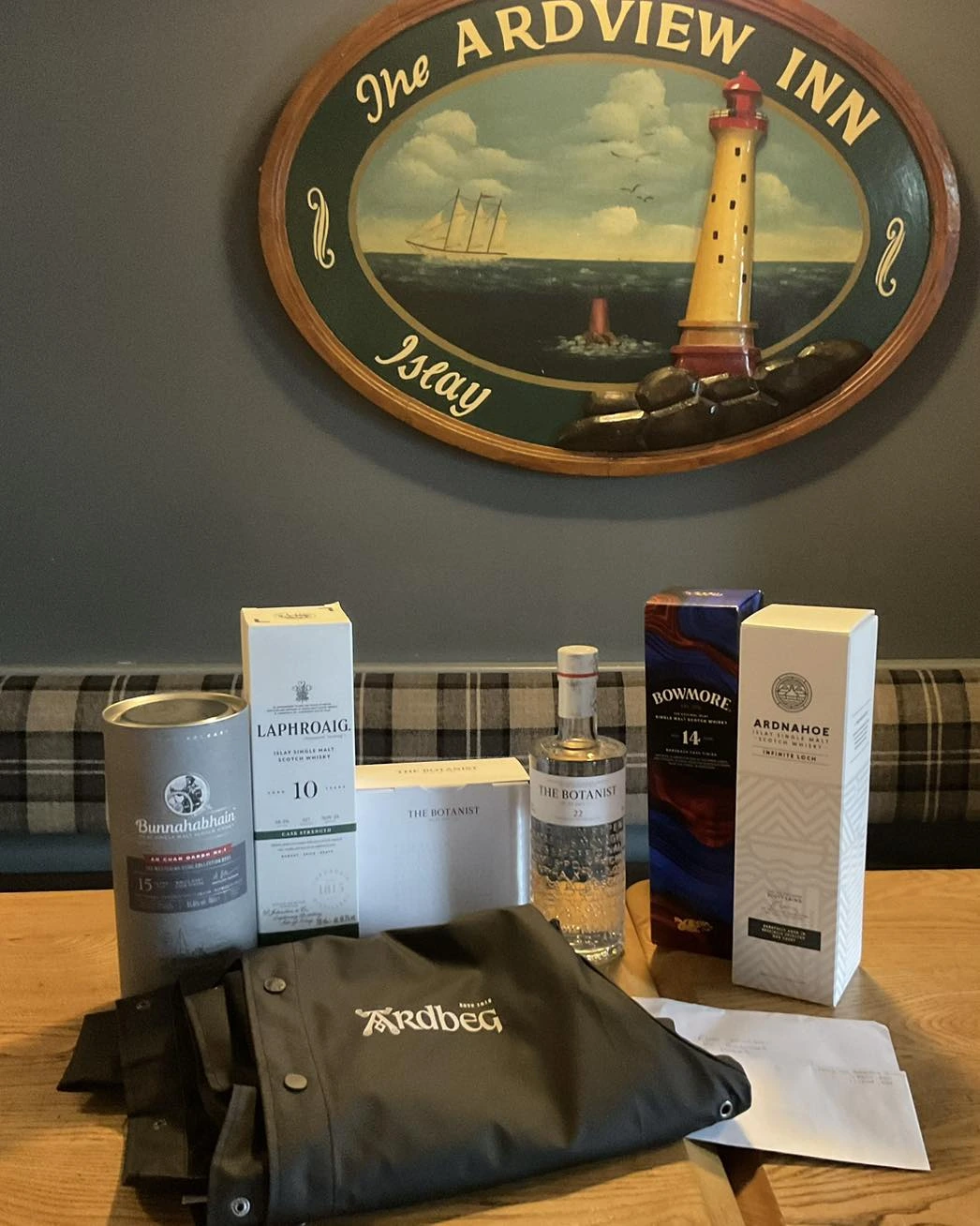 Ardview Inn branded display with drinks and merchandise on a table