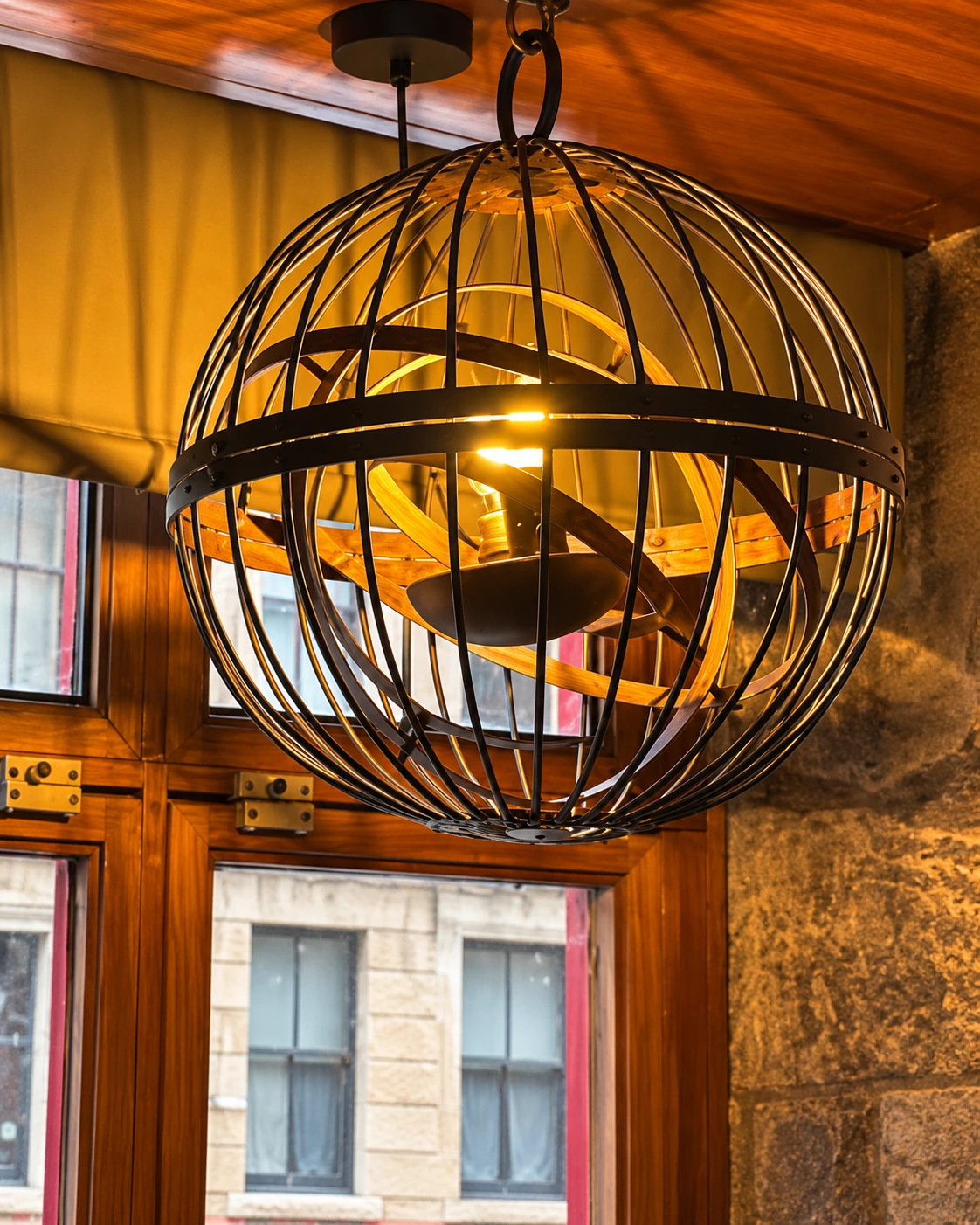Decorative caged pendant light inside The Burgh Bar Partick