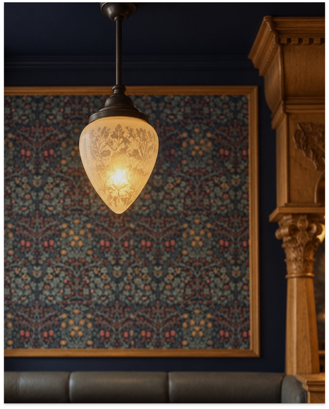 Pendant light against dark patterned wallpaper at Milne’s in Dunoon